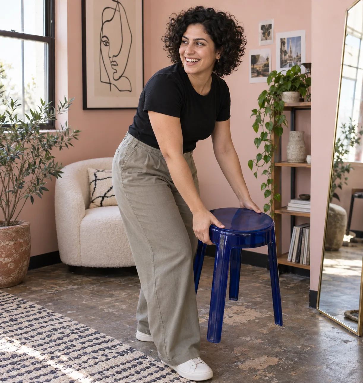 Woman sharing a candid moment in a colorful studio corner